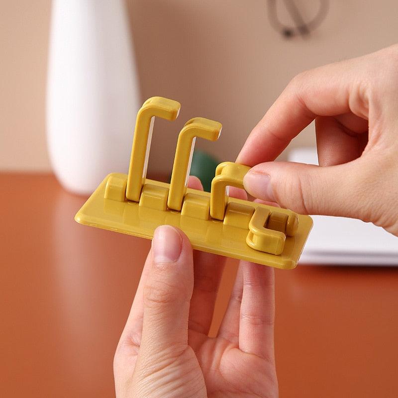 360° Rotating Adhesive Wall Hook                                            A space-saving rotating hook for organizing your bathroom, kitchen, bedroom, or entryway